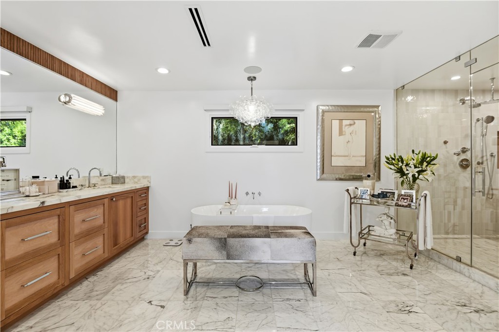 5565 Jed Smith Road Hidden Hills, CA 91302 - Photo 15 of 31 a spacious bathroom with a double vanity sink and a mirror