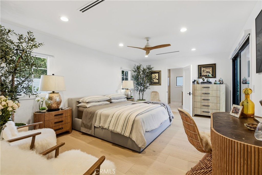 5565 Jed Smith Road Hidden Hills, CA 91302 - Photo 16 of 31 a bedroom with a bed a couch and dresser