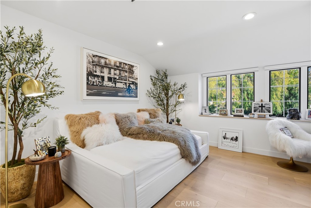 5565 Jed Smith Road Hidden Hills, CA 91302 - Photo 18 of 31 a living room with a large bed and a large window