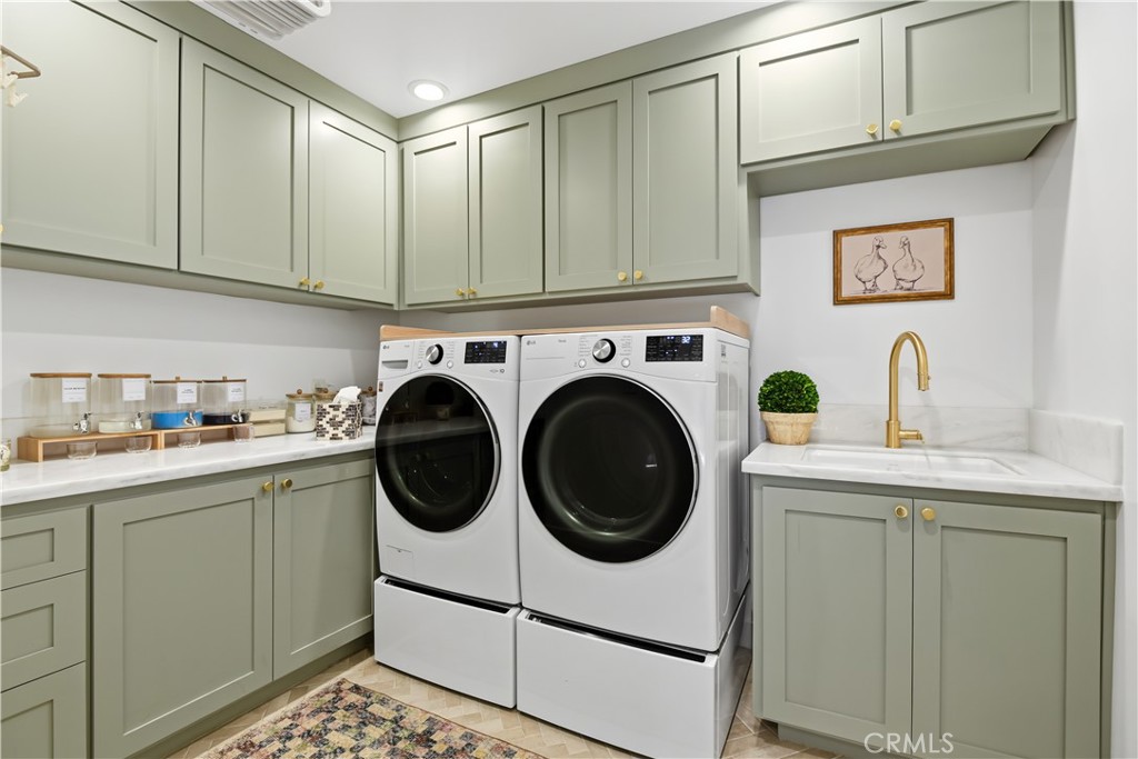 5565 Jed Smith Road Hidden Hills, CA 91302 - Photo 23 of 31 a utility room with sink dryer and washer