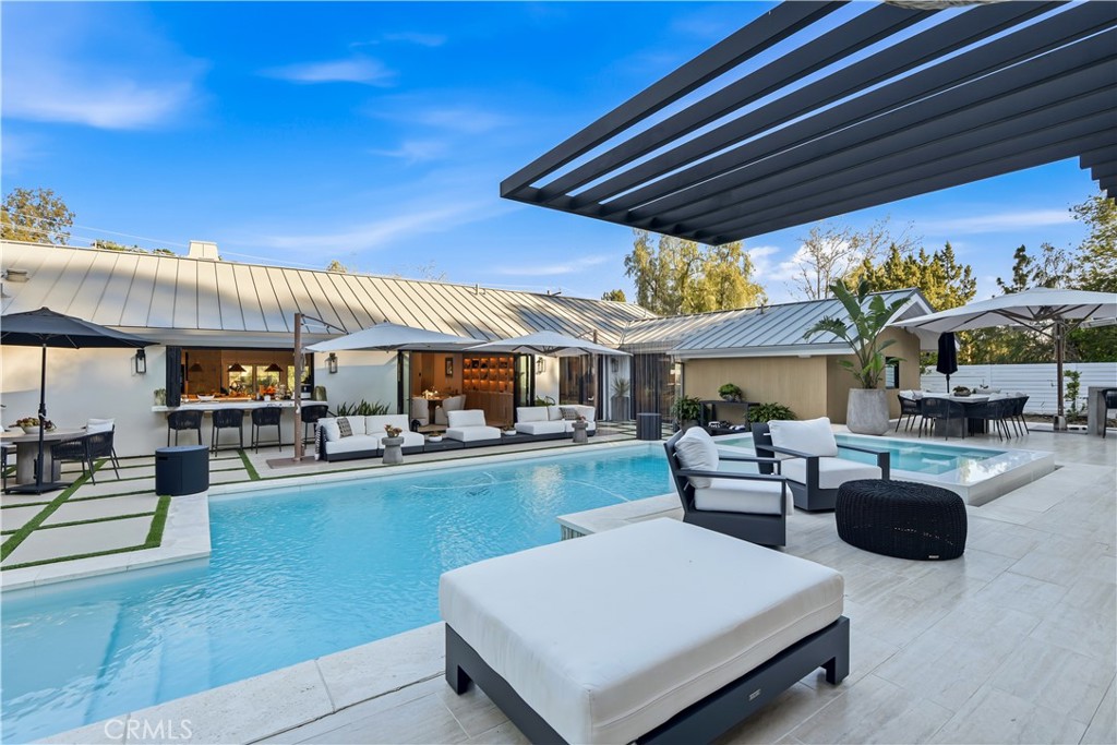 5565 Jed Smith Road Hidden Hills, CA 91302 - Photo 25 of 31 a living room with furniture and a fireplace