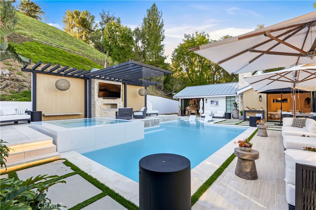 5565 Jed Smith Road Hidden Hills, CA 91302 - Photo 28 of 31 a view of a patio with swimming pool table and chairs