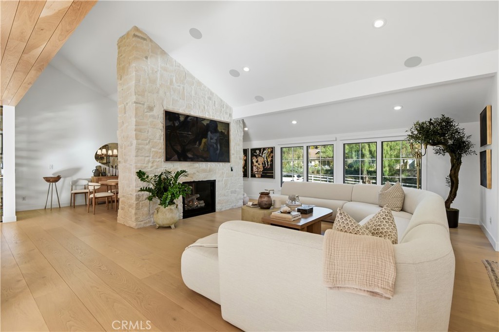5565 Jed Smith Road Hidden Hills, CA 91302 - Photo 5 of 31 a living room with fireplace furniture and a flat screen tv