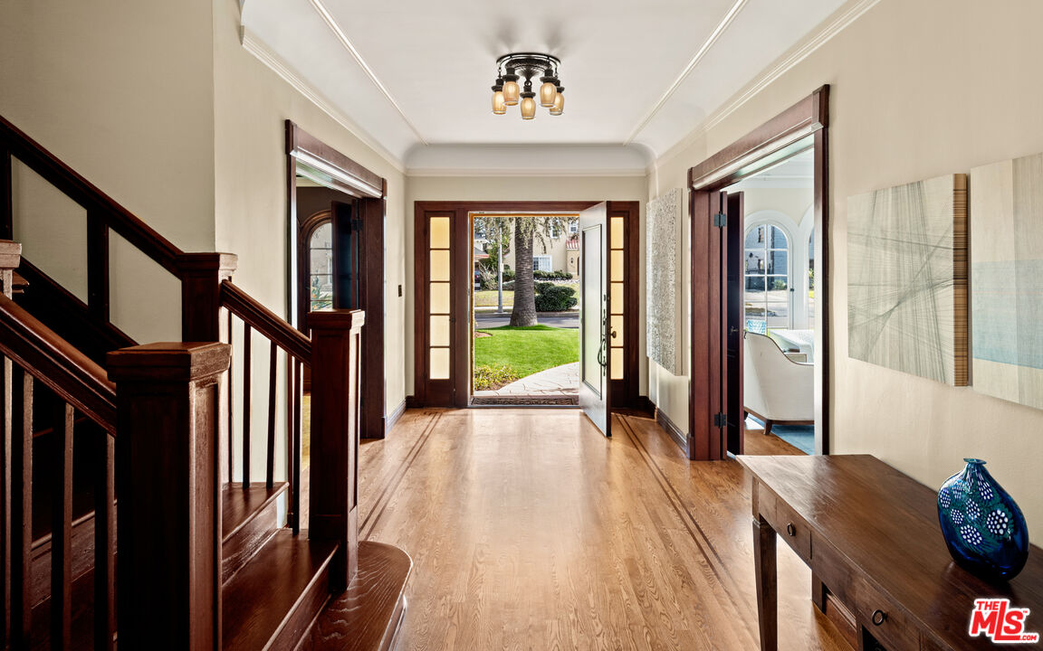 1663 Wellington Road Los Angeles, CA 90019 - Photo 14 of 45 a view of a hallway with wooden floor and windows