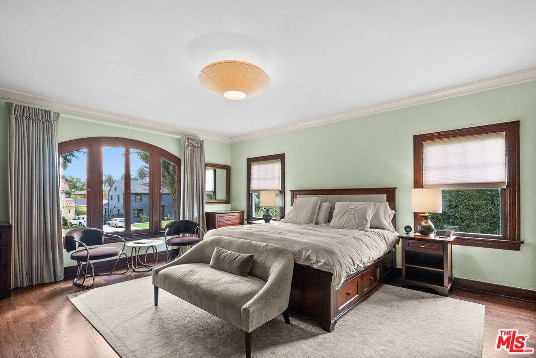 1663 Wellington Road Los Angeles, CA 90019 - Photo 24 of 45 a bedroom with a bed and a large window