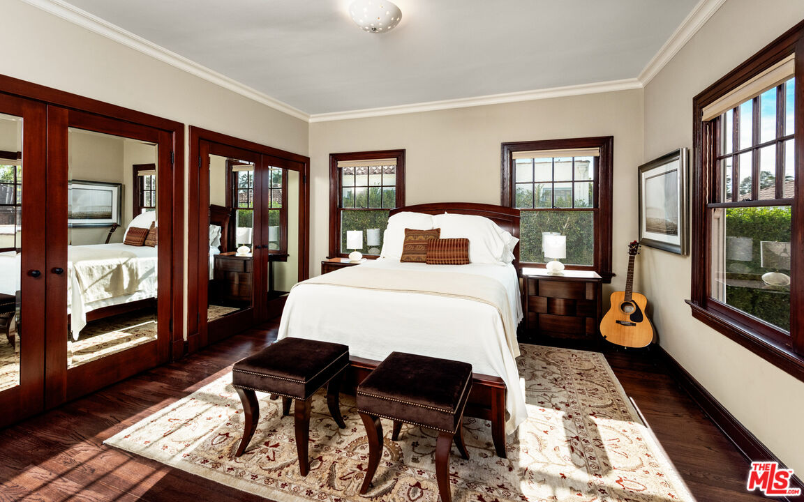 1663 Wellington Road Los Angeles, CA 90019 - Photo 26 of 45 a bedroom with a bed and wooden floor