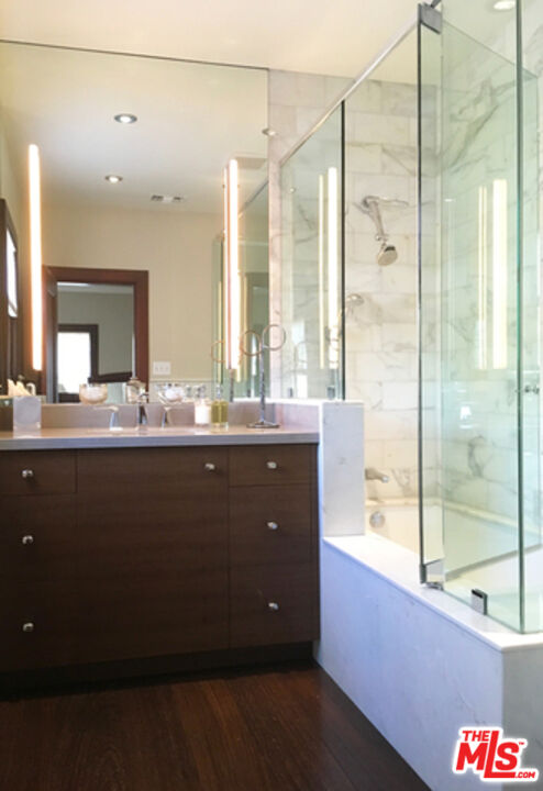 1663 Wellington Road Los Angeles, CA 90019 - Photo 28 of 45 a bathroom with a sink double vanity and a shower