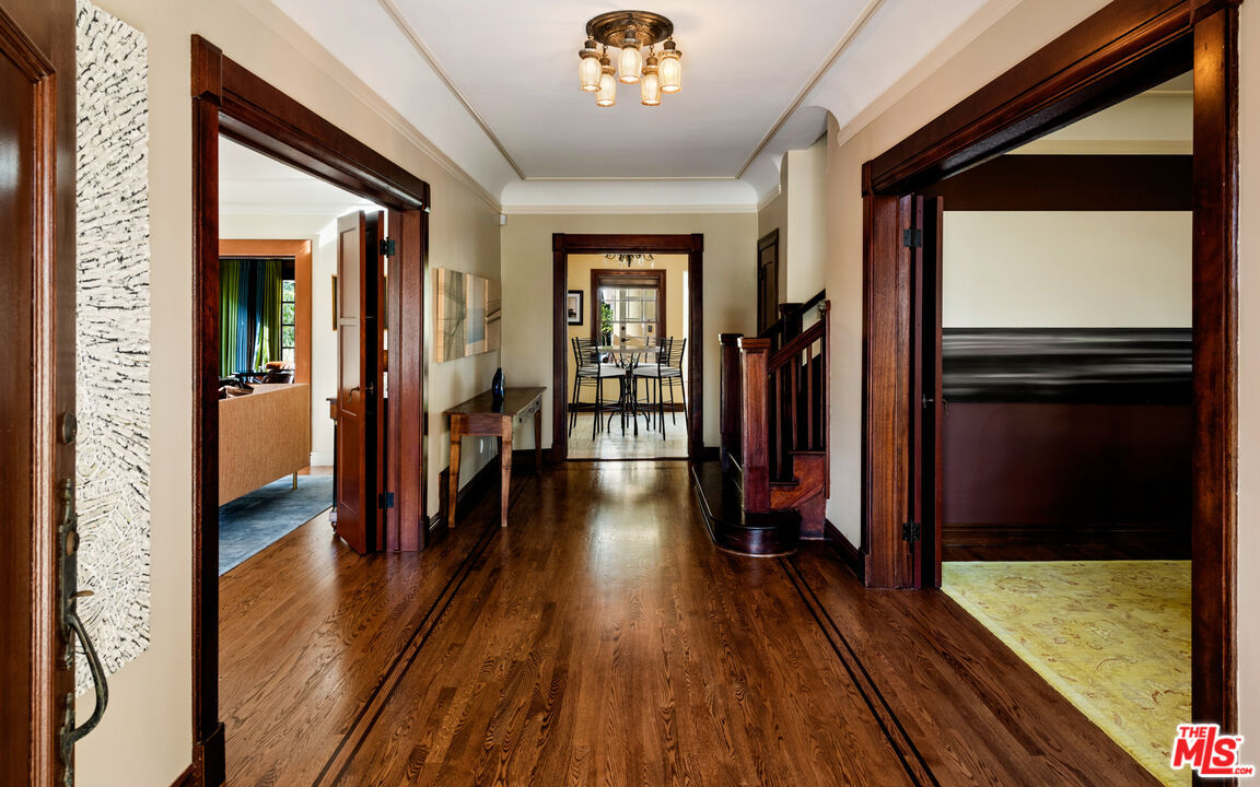 1663 Wellington Road Los Angeles, CA 90019 - Photo 3 of 45 a view of a hallway view with wooden floor and staircase