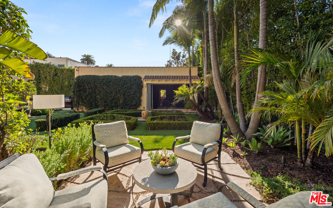 1663 Wellington Road Los Angeles, CA 90019 - Photo 35 of 45 a view of a patio with couches table and chairs and potted plants