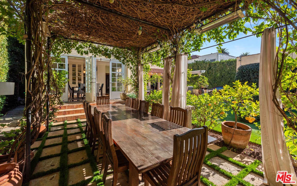 1663 Wellington Road Los Angeles, CA 90019 - Photo 36 of 45 a view of an outdoor dining space with a table and chairs