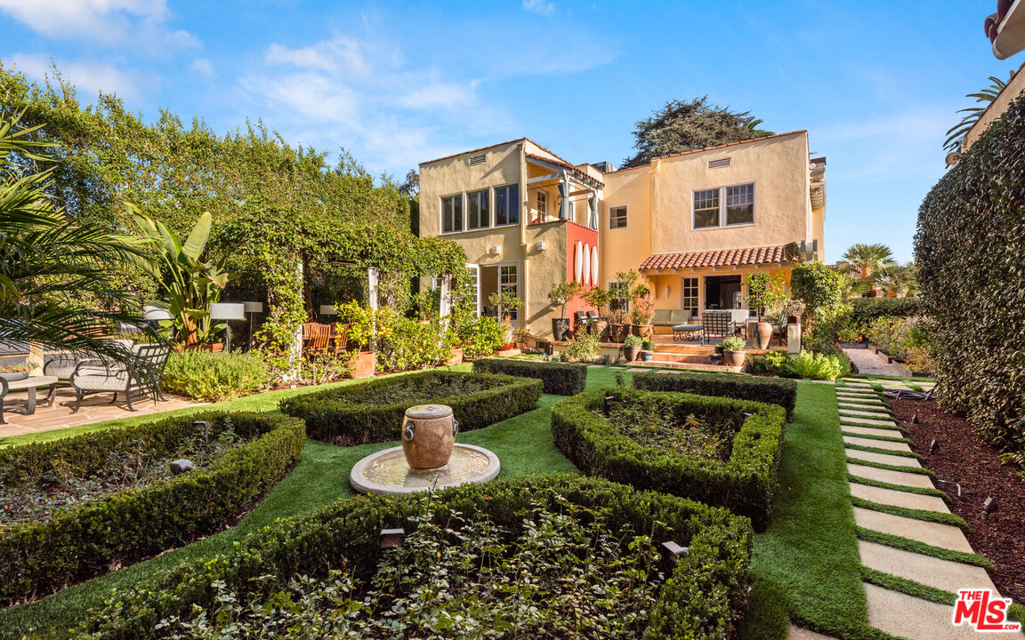 1663 Wellington Road Los Angeles, CA 90019 - Photo 38 of 45 a front view of a house with a garden and sitting area