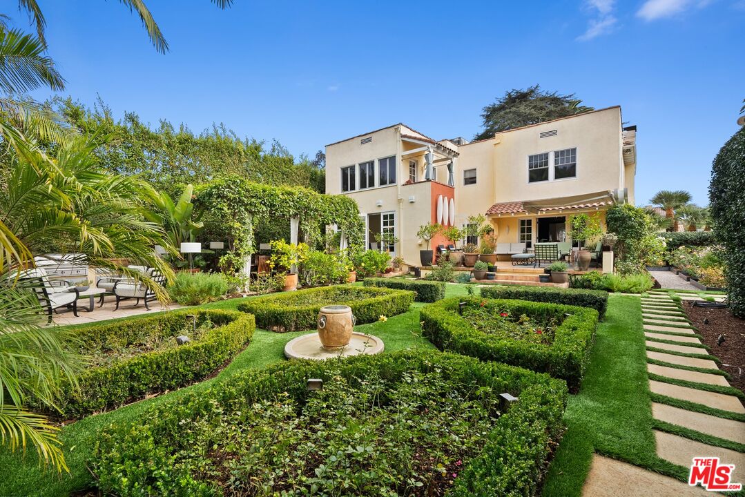 1663 Wellington Road Los Angeles, CA 90019 - Photo 39 of 45 a view of a house with a yard and plants