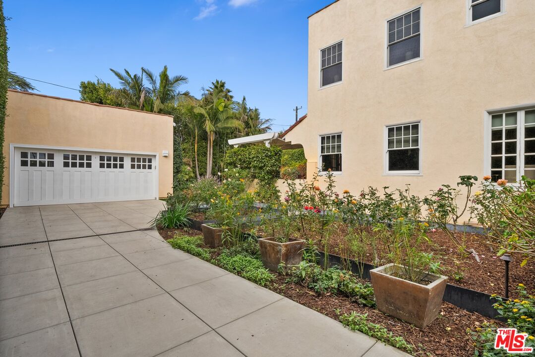 1663 Wellington Road Los Angeles, CA 90019 - Photo 44 of 45 a view of a sign board with flower plants