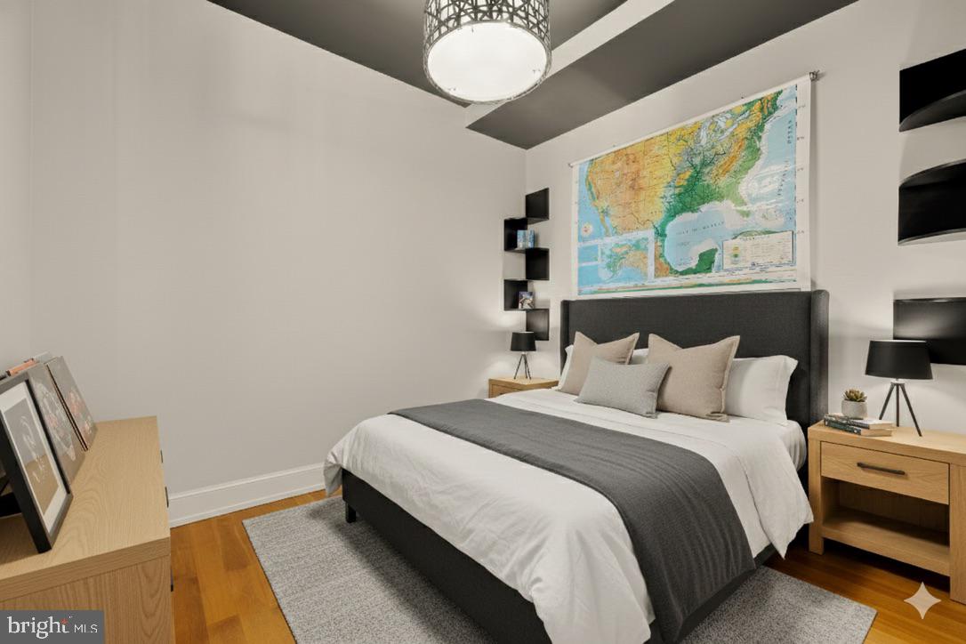 215 I Street Northeast, Unit 311 Washington, DC 20002 - Photo 21 of 38 a bedroom with a bed and a flat screen tv