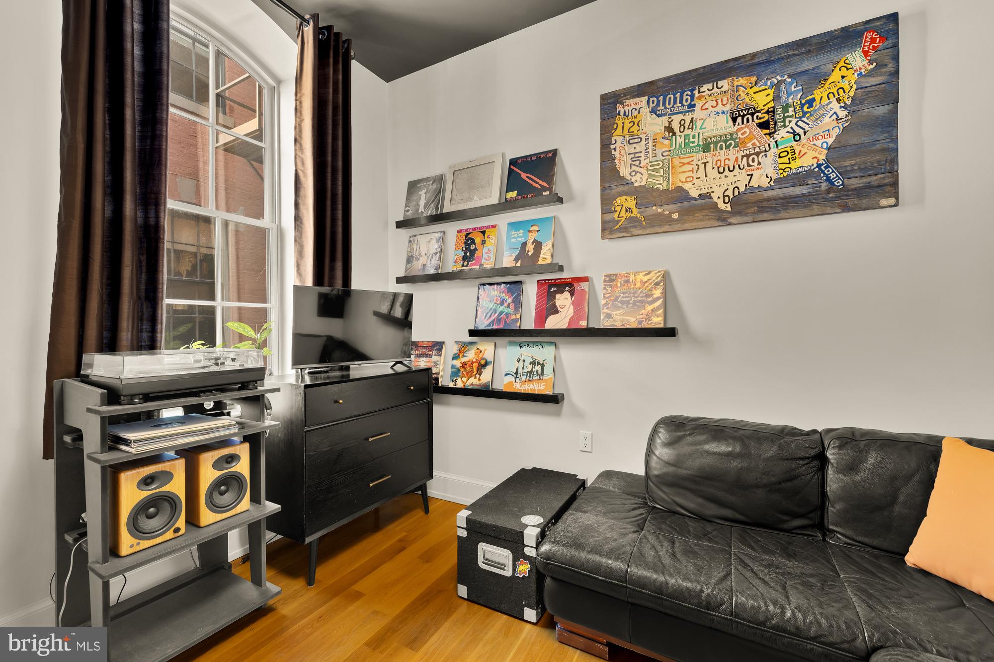 215 I Street Northeast, Unit 311 Washington, DC 20002 - Photo 22 of 38 a living room with furniture and a window