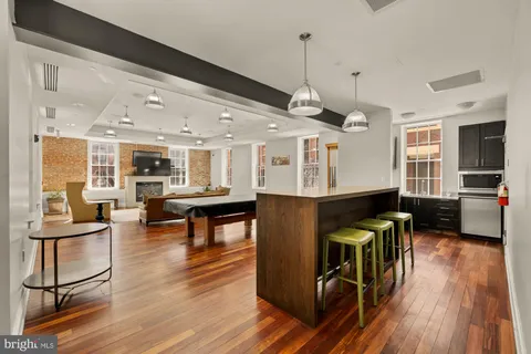 a kitchen that has a stove and a table