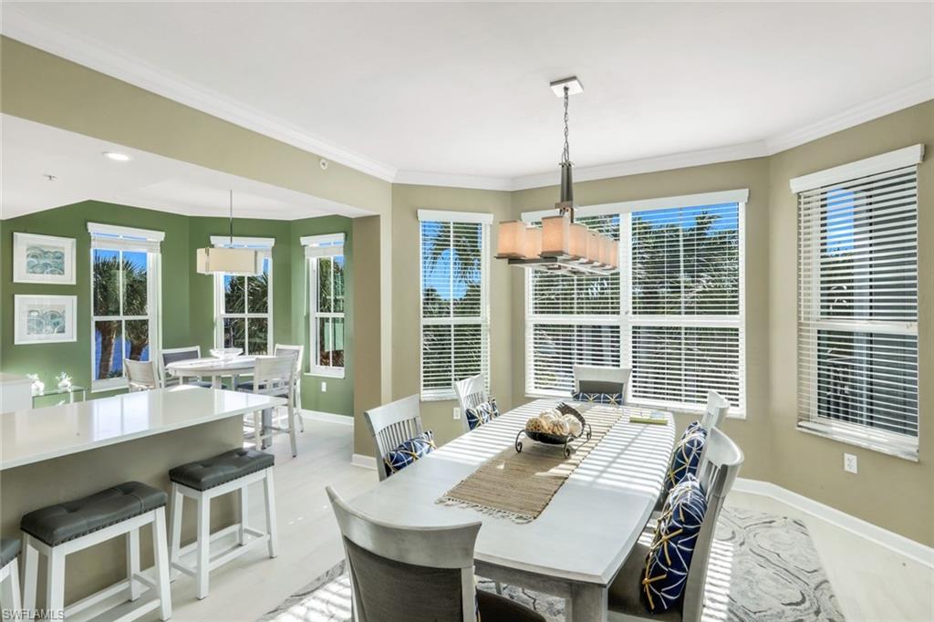 300 Dunes Boulevard, Unit 201 Naples, FL 34110 - Photo 12 of 50 a view of a dining room with furniture window and outside view