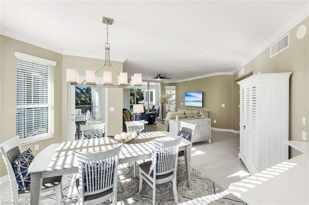 300 Dunes Boulevard, Unit 201 Naples, FL 34110 - Photo 50 of 50 a view of a dining room with furniture