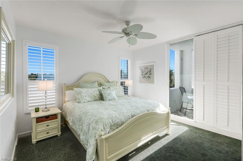 300 Dunes Boulevard, Unit 201 Naples, FL 34110 - Photo 24 of 50 a bedroom with a bed and a window