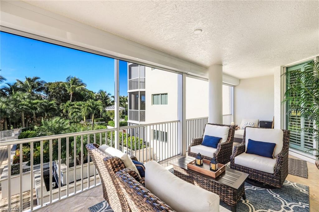 300 Dunes Boulevard, Unit 201 Naples, FL 34110 - Photo 27 of 50 a view of a chairs in balcony