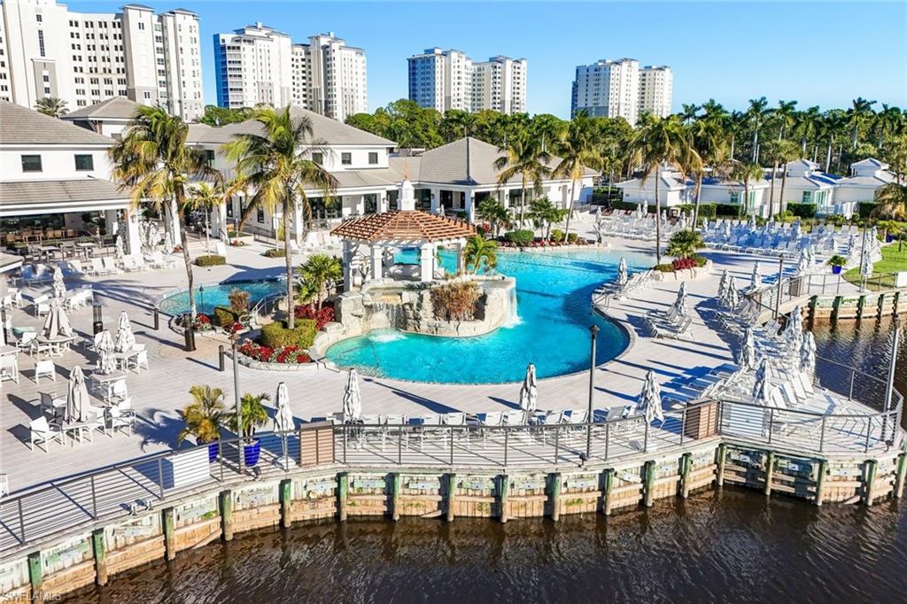 300 Dunes Boulevard, Unit 201 Naples, FL 34110 - Photo 34 of 50 a view of multiple houses with outdoor seating