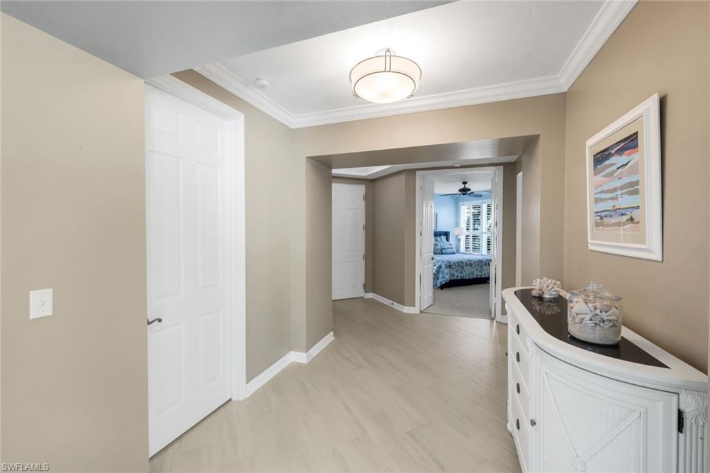 300 Dunes Boulevard, Unit 201 Naples, FL 34110 - Photo 7 of 50 a view of an entryway with wooden floor