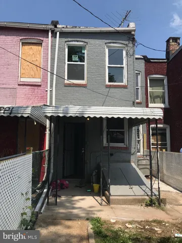 a view of room with window and wooden floor