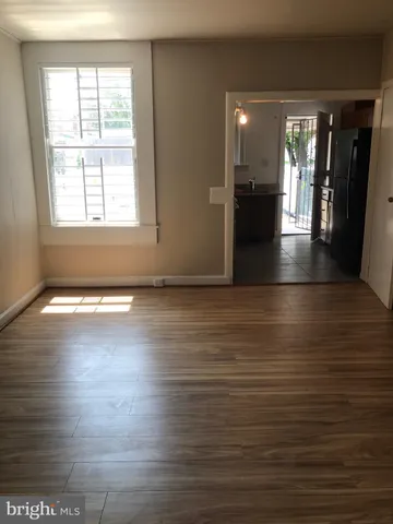 a kitchen with a refrigerator and a sink
