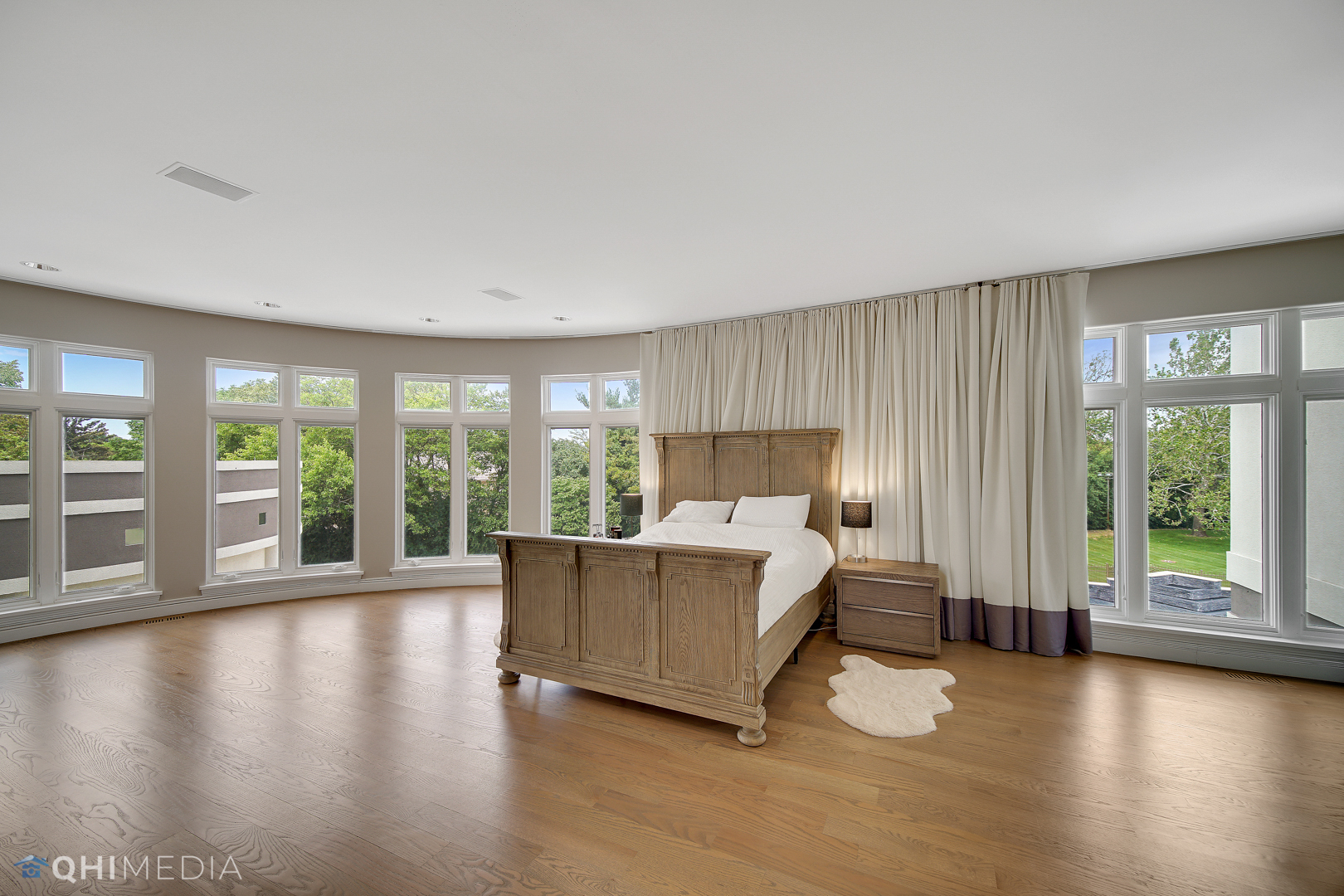 Undisclosed Address Oak Brook, IL 60523 - Photo 27 of 65 a bed room with a bed and large windows