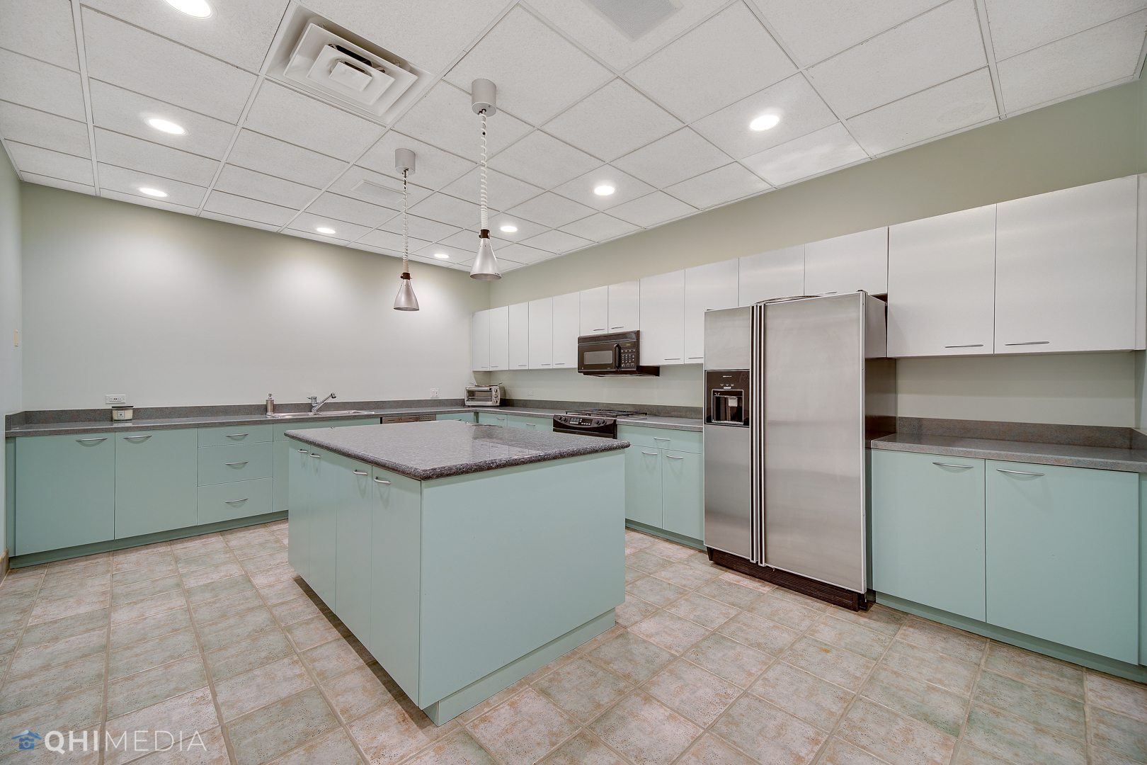 Undisclosed Address Oak Brook, IL 60523 - Photo 36 of 65 a kitchen with granite countertop a sink and a refrigerator