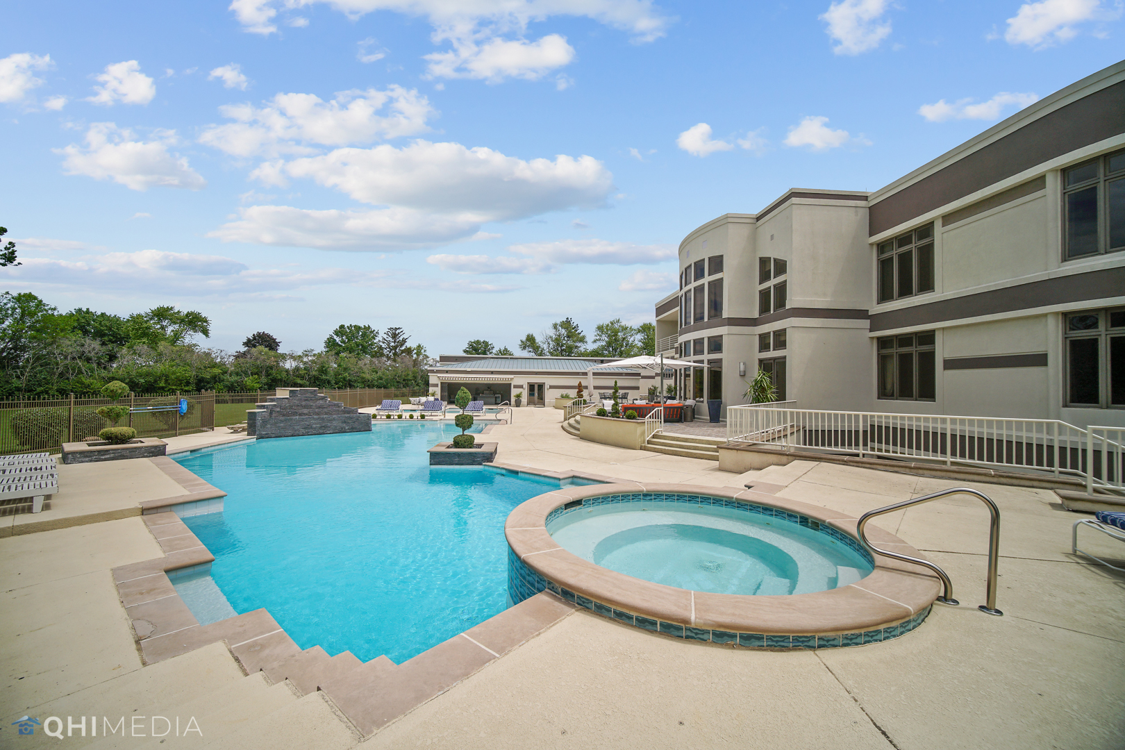 Undisclosed Address Oak Brook, IL 60523 - Photo 5 of 65 a swimming pool with outdoor seating and barbeque