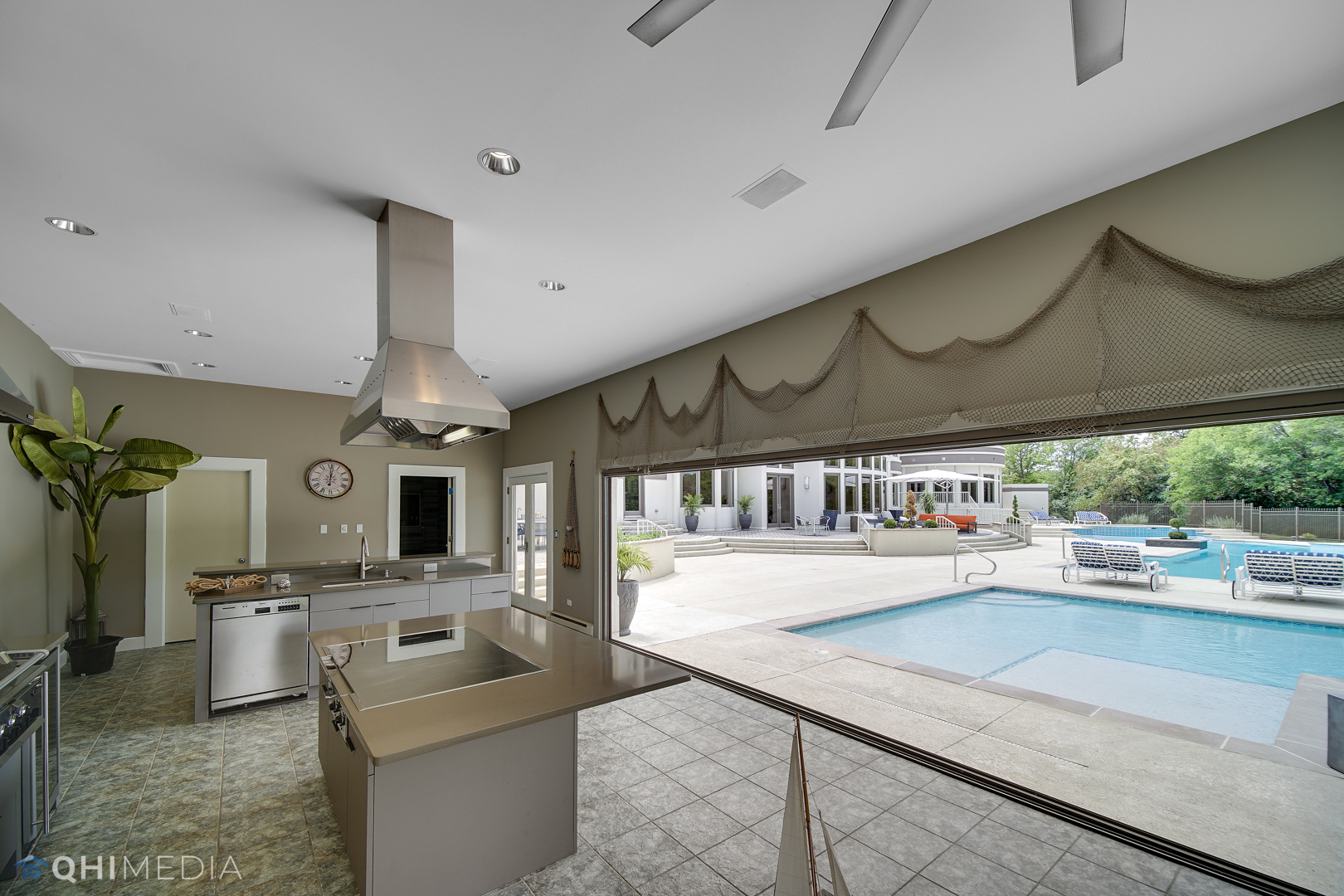 Undisclosed Address Oak Brook, IL 60523 - Photo 43 of 65 a open kitchen with stainless steel appliances kitchen island granite countertop a sink and white cabinets