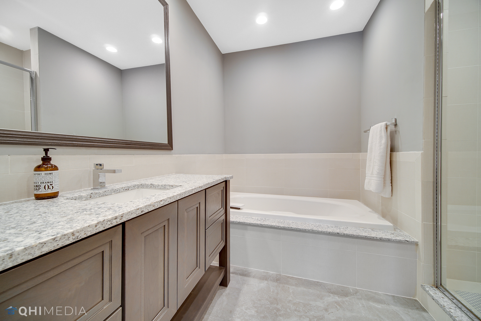 Undisclosed Address Oak Brook, IL 60523 - Photo 56 of 65 a bathroom with a granite countertop sink and a bathtub