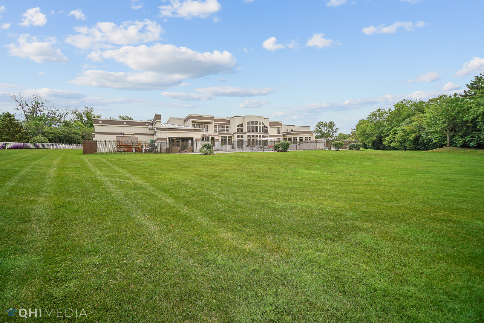 Undisclosed Address Oak Brook, IL 60523 - Photo 62 of 65 a view of a big yard with a house in the background