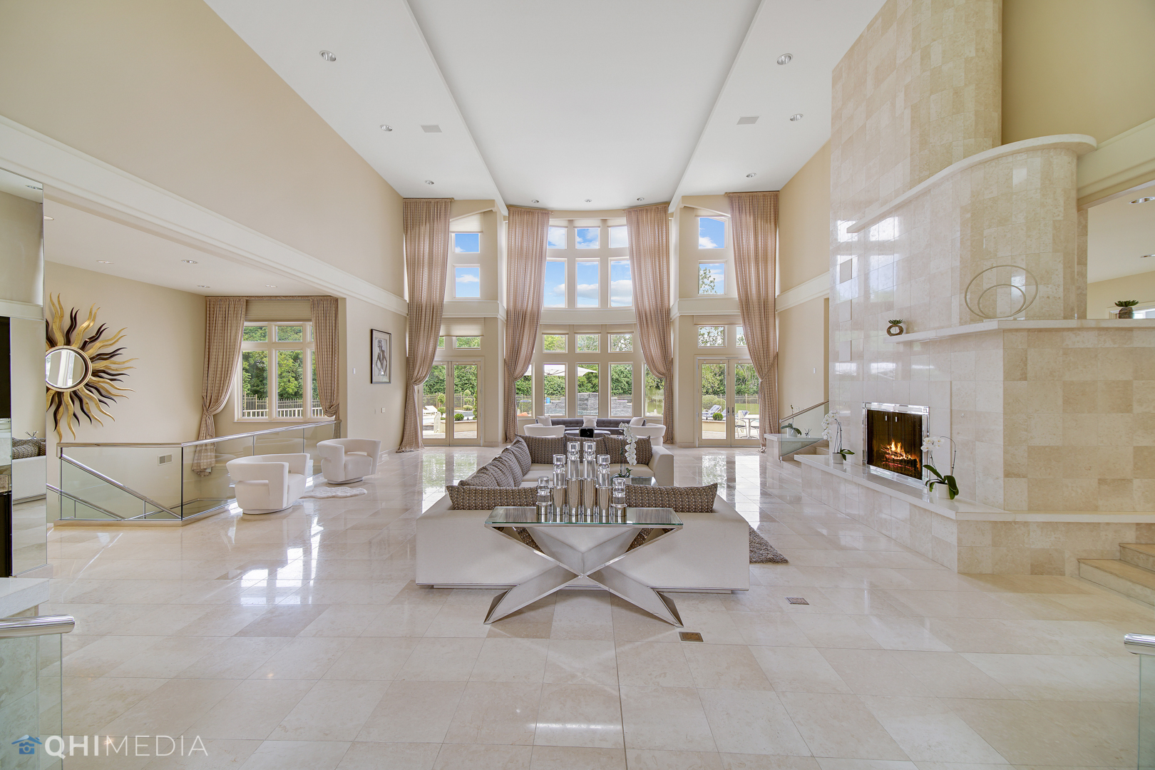 Undisclosed Address Oak Brook, IL 60523 - Photo 8 of 65 a living room with furniture large windows and a fireplace