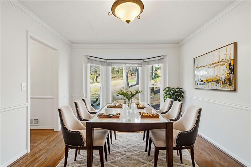 130 Spring Ridge Court Roswell, GA 30076 - Photo 16 of 47 a view of a dining room with furniture window and wooden floor