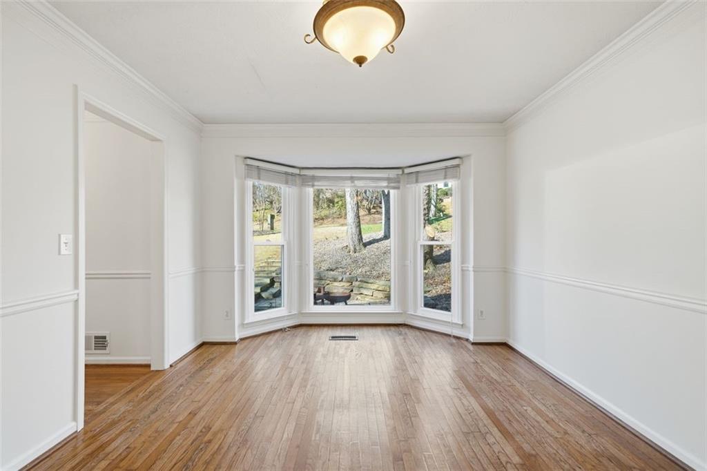 130 Spring Ridge Court Roswell, GA 30076 - Photo 17 of 47 wooden floor in an empty room with a window