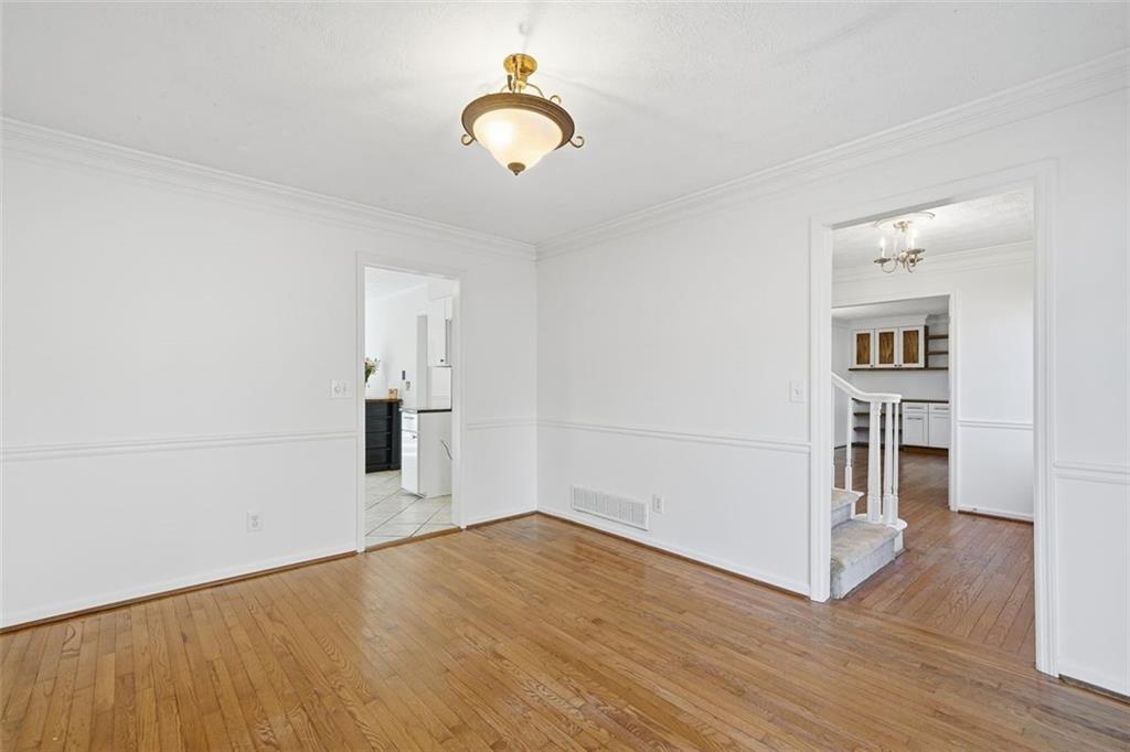130 Spring Ridge Court Roswell, GA 30076 - Photo 18 of 47 a view of empty room with wooden floor