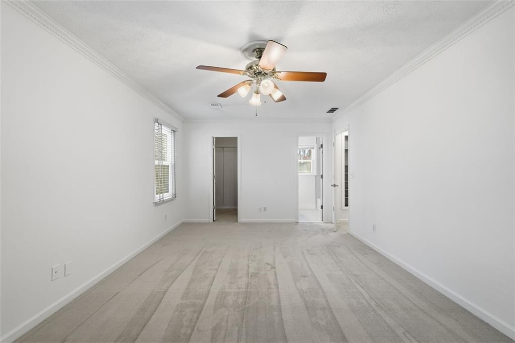 130 Spring Ridge Court Roswell, GA 30076 - Photo 20 of 47 wooden floor in an empty room with a window