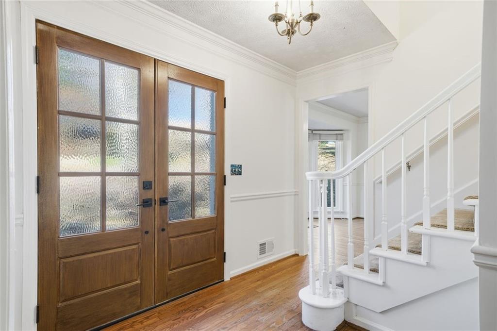 130 Spring Ridge Court Roswell, GA 30076 - Photo 2 of 47 a living room with furniture and wooden floor