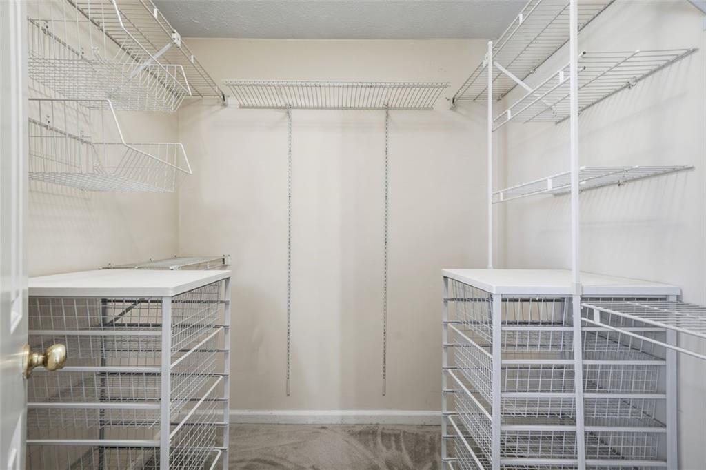 130 Spring Ridge Court Roswell, GA 30076 - Photo 24 of 47 a view of a room with racks on the wall