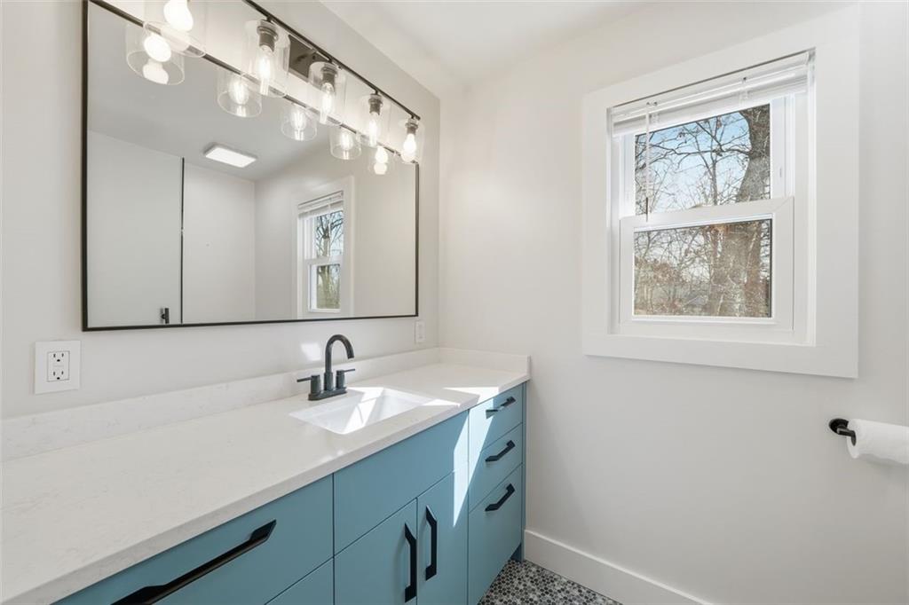 130 Spring Ridge Court Roswell, GA 30076 - Photo 26 of 47 a bathroom with a sink mirror and vanity