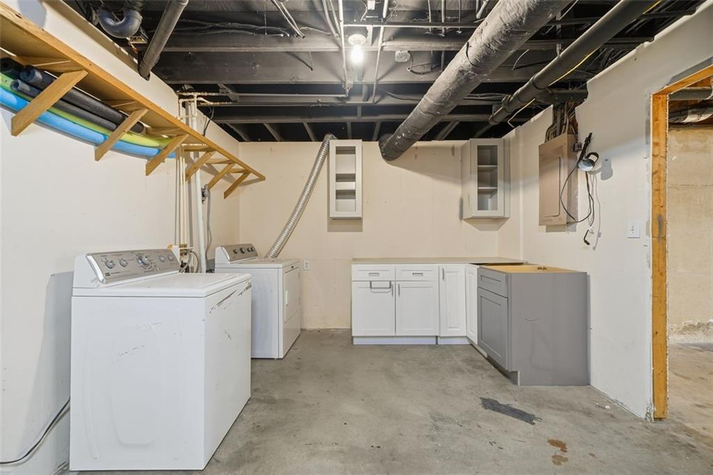 130 Spring Ridge Court Roswell, GA 30076 - Photo 31 of 47 a utility room with dryer and washer