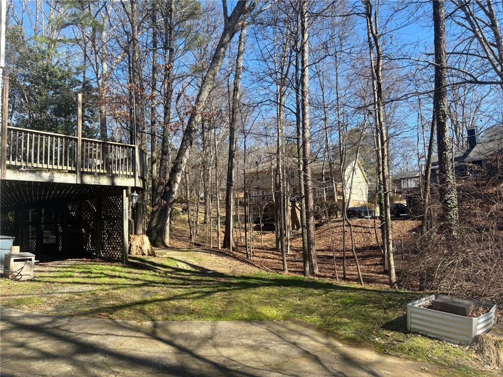 130 Spring Ridge Court Roswell, GA 30076 - Photo 34 of 47 a view of a house with a backyard