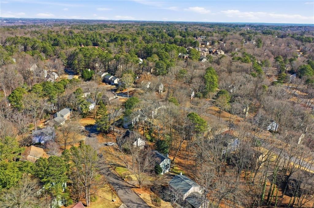 130 Spring Ridge Court Roswell, GA 30076 - Photo 39 of 47 a view of a city with lush green forest