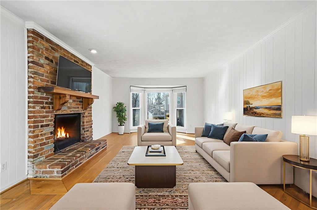 130 Spring Ridge Court Roswell, GA 30076 - Photo 5 of 47 a living room with furniture and a fireplace