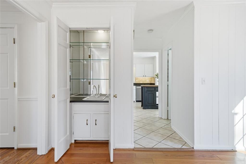 130 Spring Ridge Court Roswell, GA 30076 - Photo 10 of 47 a bathroom with a granite countertop sink and a mirror