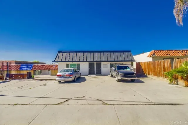 a view of a cars park in front of house