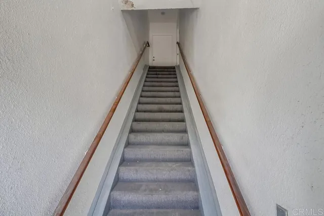 a front view of a house with parking space