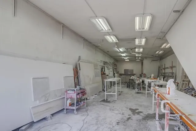 a view of a room with lots of chairs and chandelier